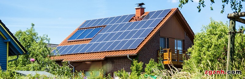 house with solar panels in summer